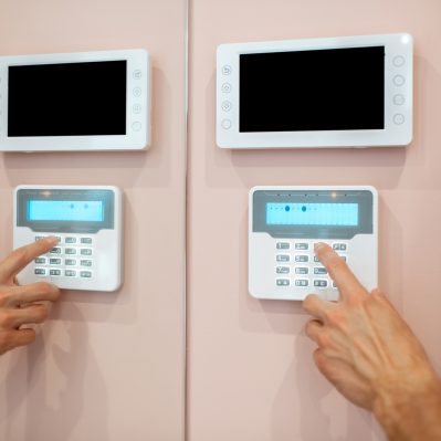 Man setting up the home alarm